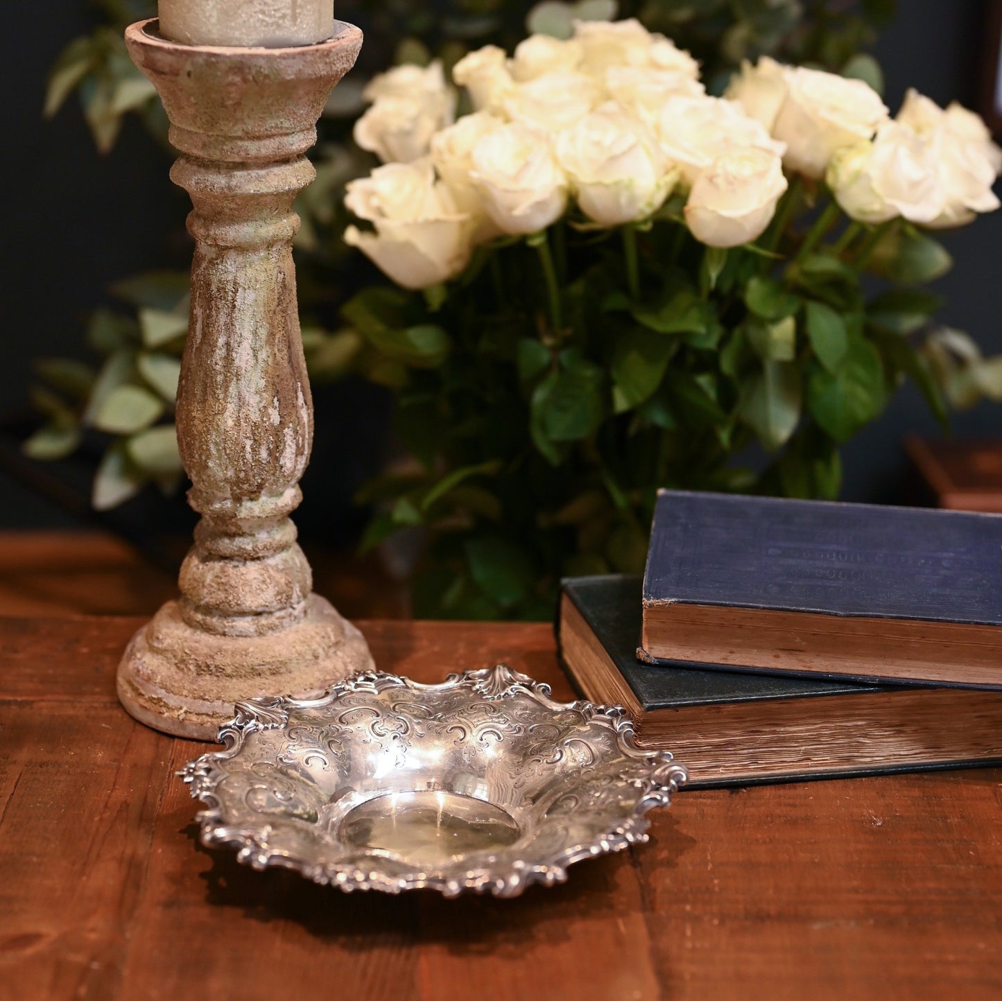 This antique Victorian silver dish is adorned with C-scrolls, acanthus flourishes, and floral motifs.