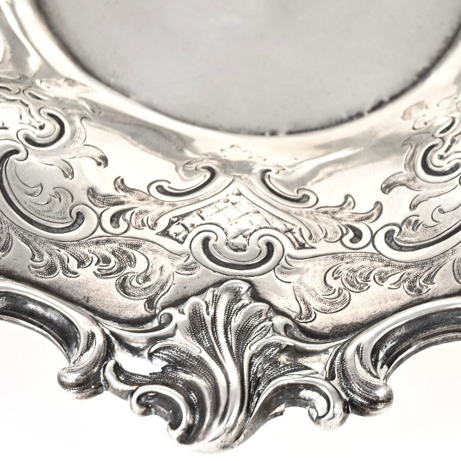 Close-up of an ornate silver dish with intricate patterns