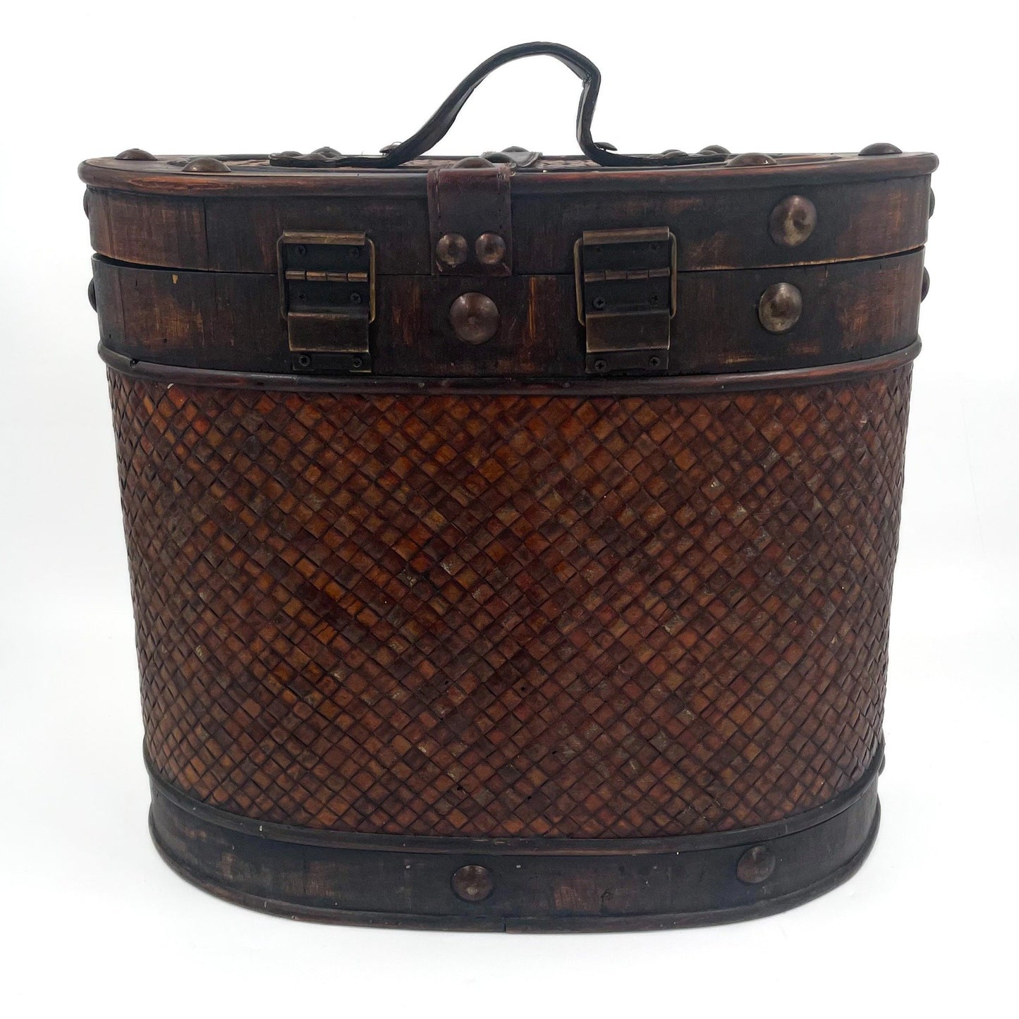 This antique storage box blends warm wood, woven lattice detail, and aged leatherette straps for a richly textured, timeworn look.