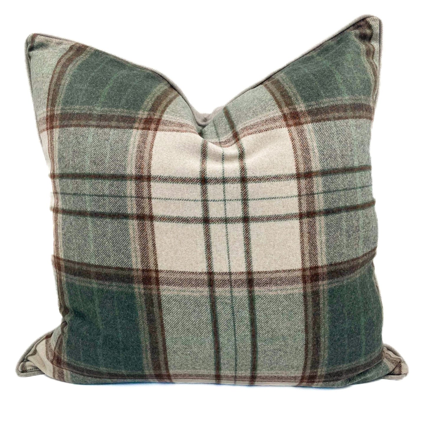 Plaid pillow with green, brown, and white colors on a white background