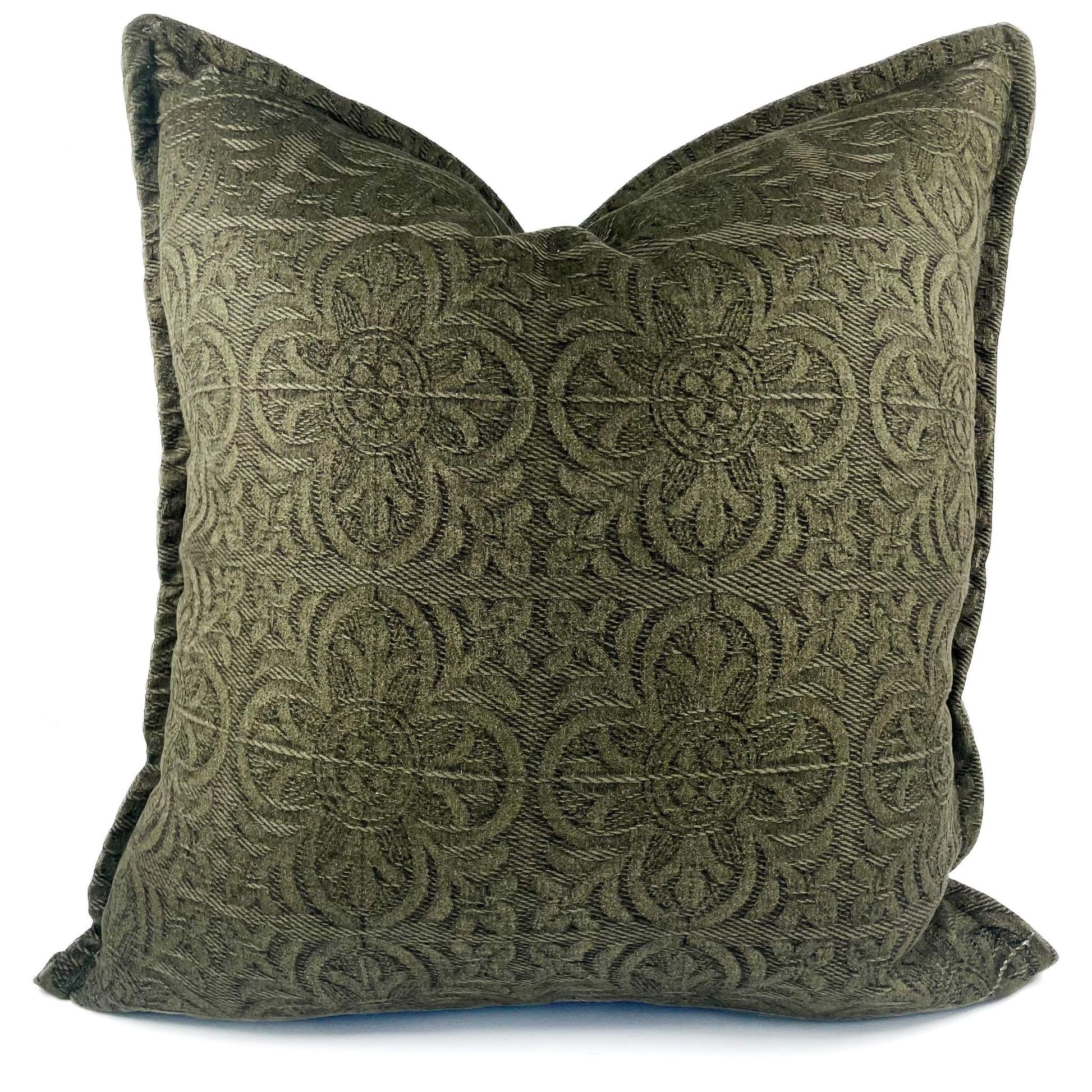 Green patterned pillow on a white background