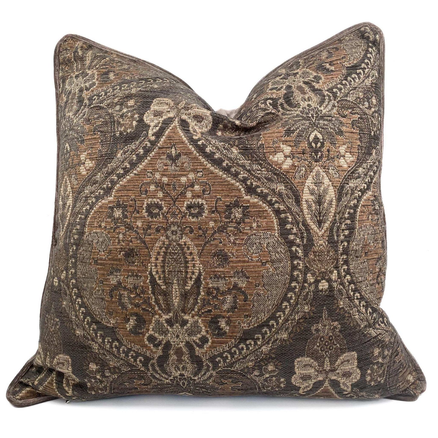 Decorative pillow with intricate brown and beige pattern on a white background