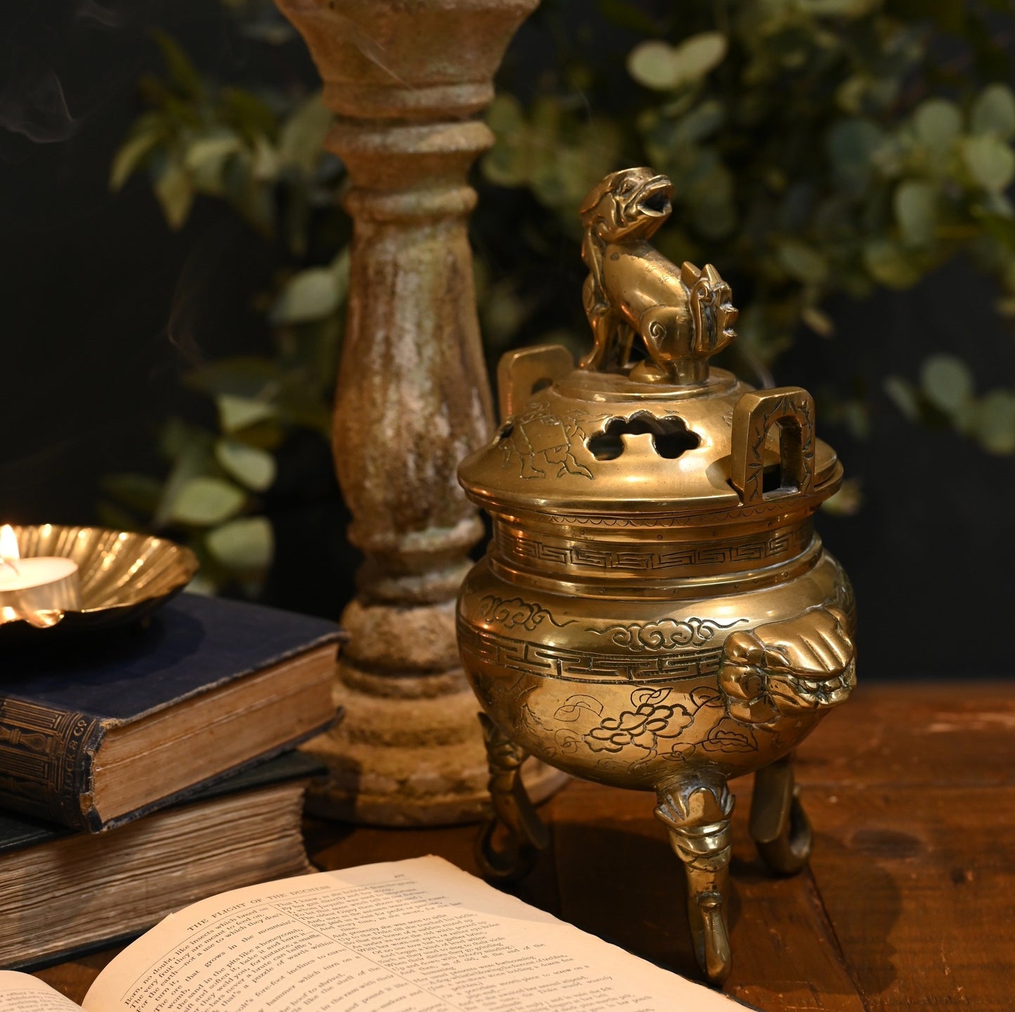 This solid brass Chinese incense burner, topped with a foo dog symbolizes protection and guardian spirit energy. Cira 1950's.