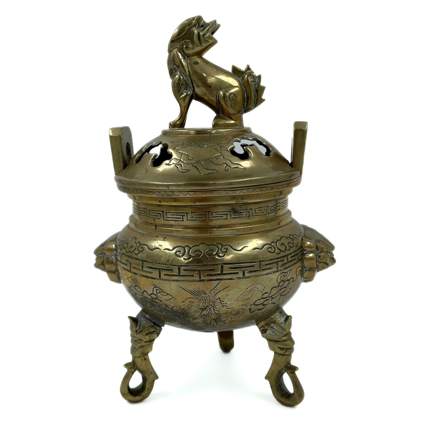 This solid brass Chinese incense burner, topped with a foo dog symbolizes protection and guardian spirit energy. Cira 1950's.