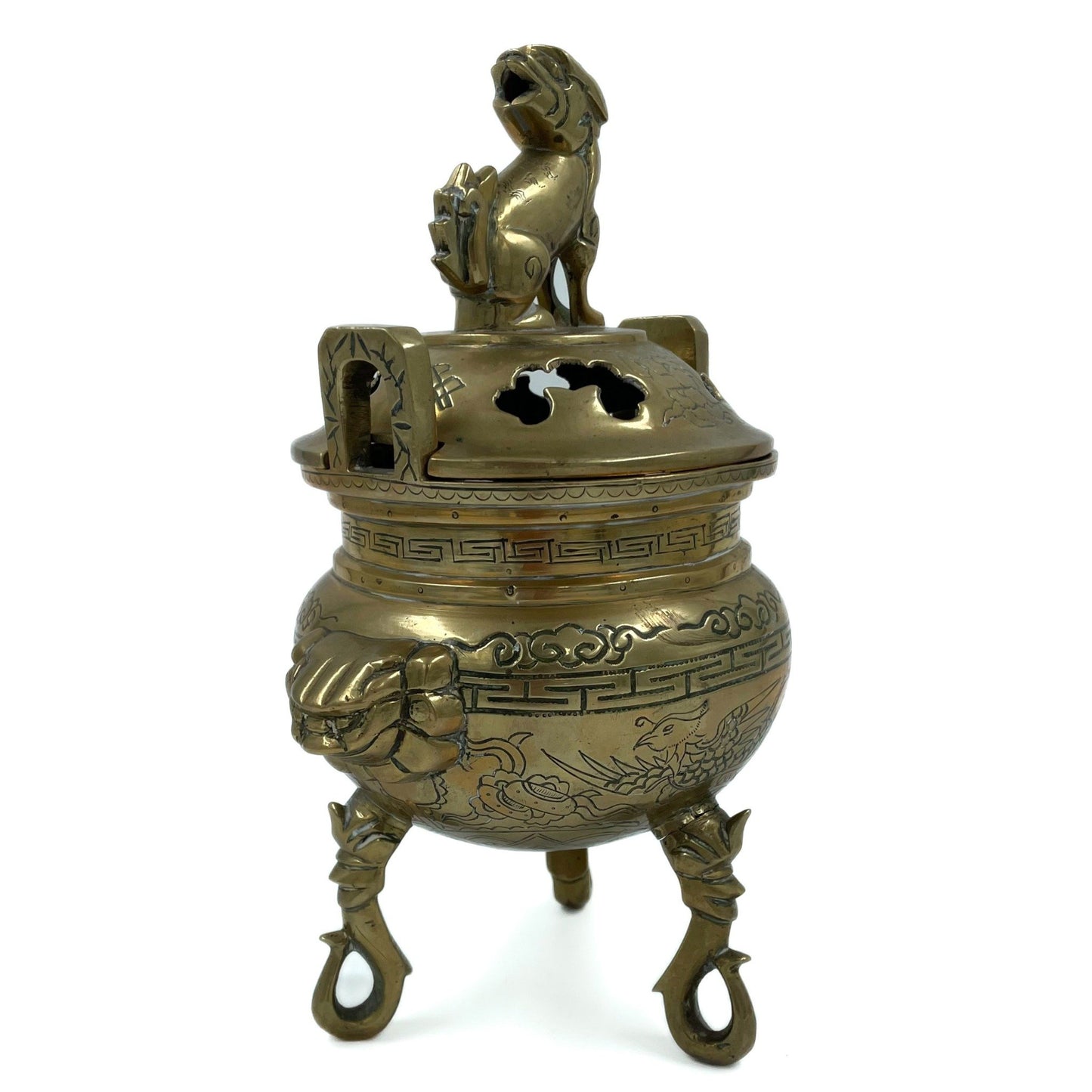 This solid brass Chinese incense burner, topped with a foo dog symbolizes protection and guardian spirit energy. Cira 1950's.