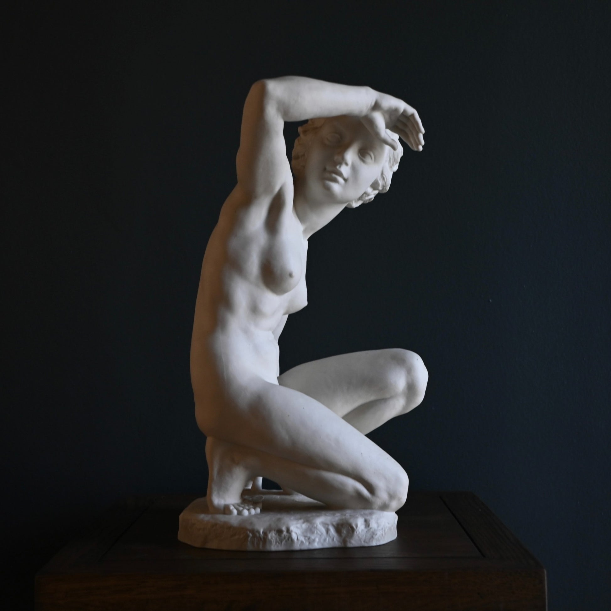 Elegant mid-century Hutschenreuther porcelain figurine by Carl Werner in Blanc de Chine, capturing serene introspection with timeless sculptural grace.