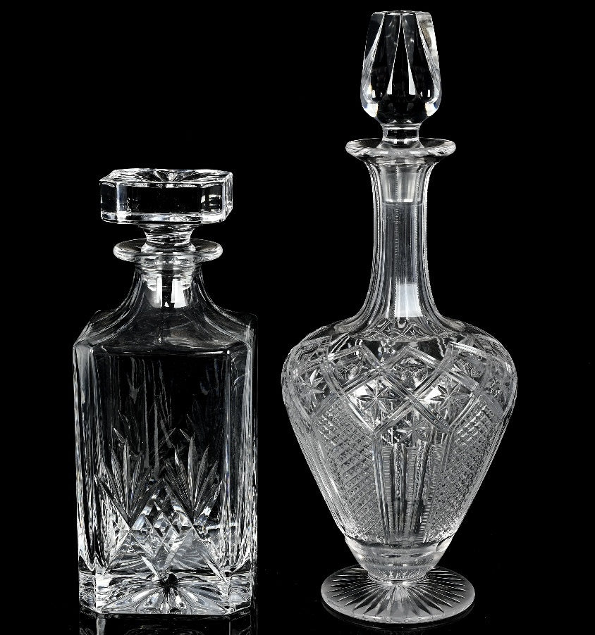 A timeless pairing of cut crystal decanters, each offering its own distinct silhouette and elegance.