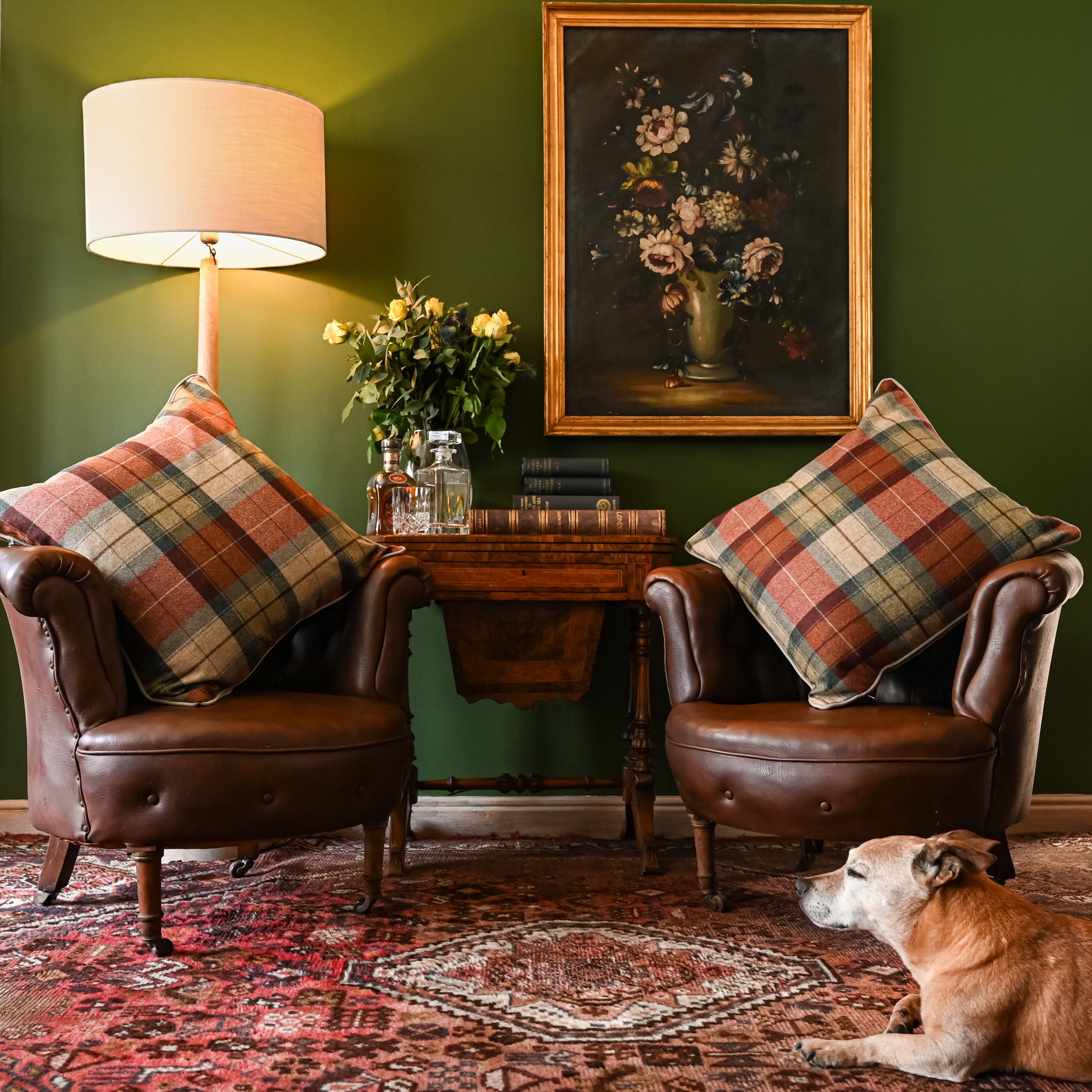 Style modern tweed scatter cushions with leather sofa, rich wood and antique collectibles