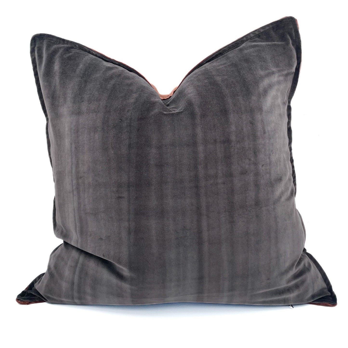 Gray velvet pillow on a white background