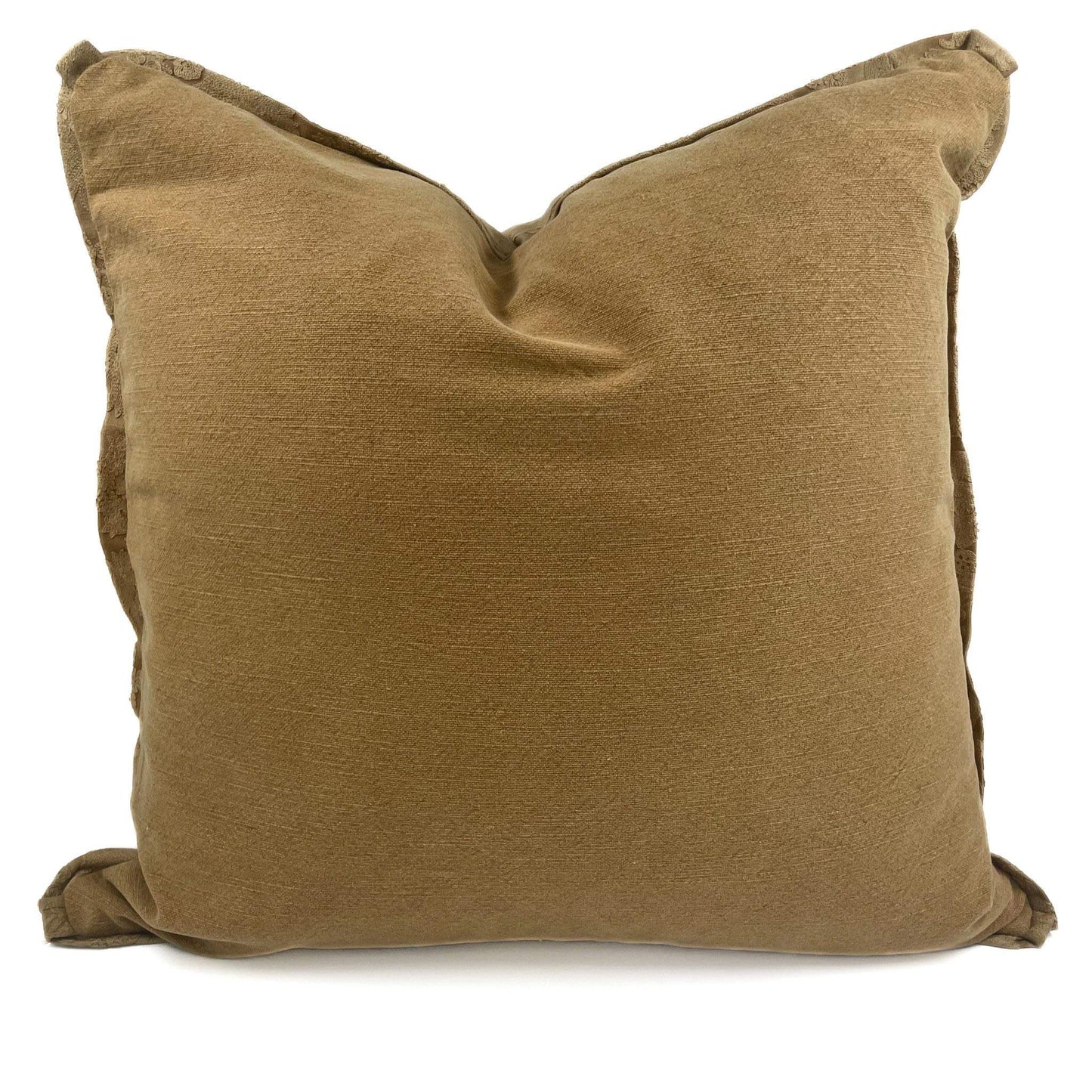 Brown pillow with tassels on a white background
