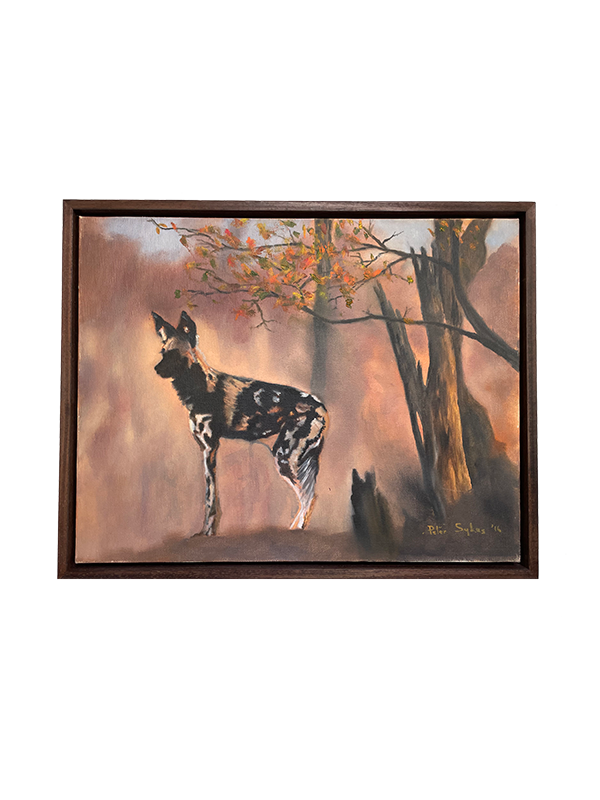 Framed oil painting of an African wild dog standing in a forest with a warm color palette.