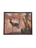 Framed oil painting of an African wild dog standing in a forest with a warm color palette.