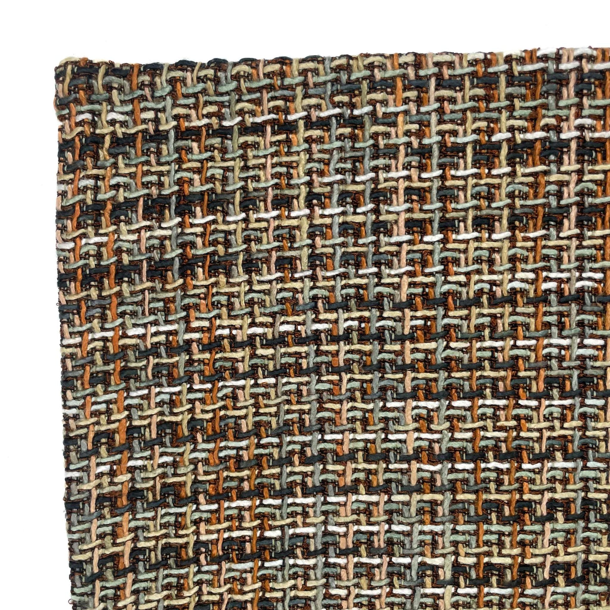 Close-up of a woven fabric with a multicolor pattern on a white background