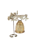 Decorative antique brass bell with intricate designs on a white background