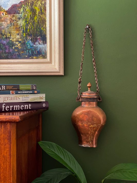 An antique copper water canteen dating back to the early 19th century styled together with modern furnishings in the kitchen or living areas