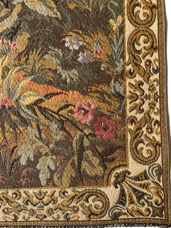 Close-up of a floral and paisley patterned tapestry corner