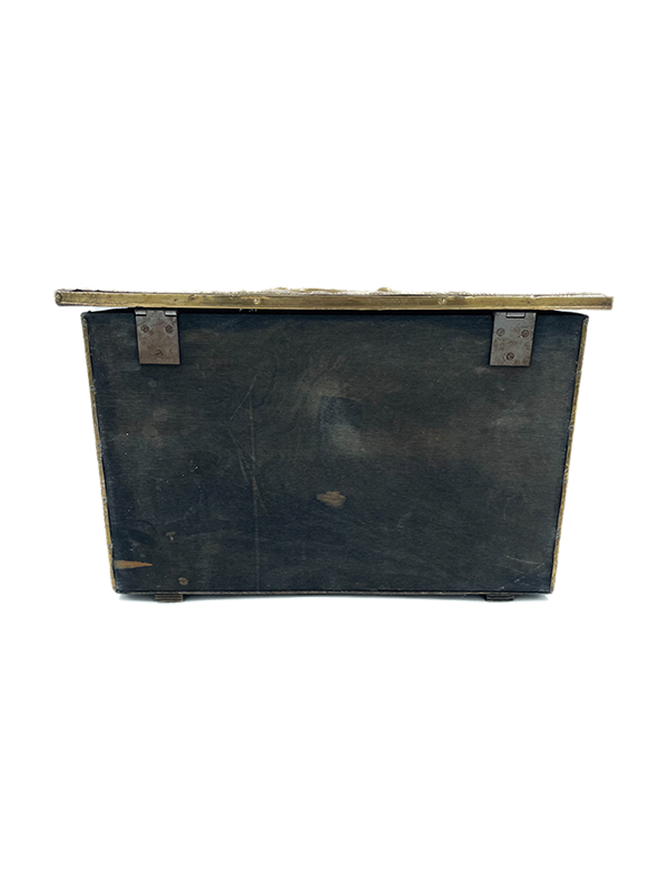 Antique brass decorative storage or firewood box with metal clasps on a white background
