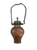 Antique copper water canteen with chain on a white background