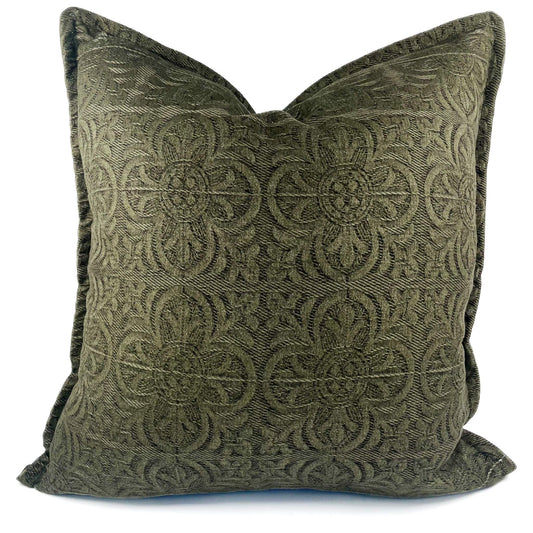Green patterned pillow on a white background