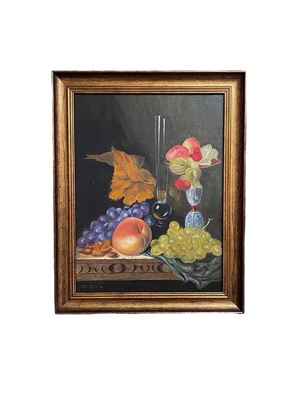 Framed still life painting with fruits and a glass on a dark background