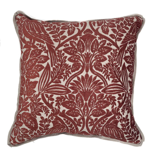 Decorative pillow with red floral pattern on a white background