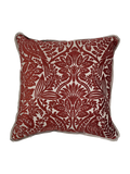 Red floral velvet patterned pillow on a white background