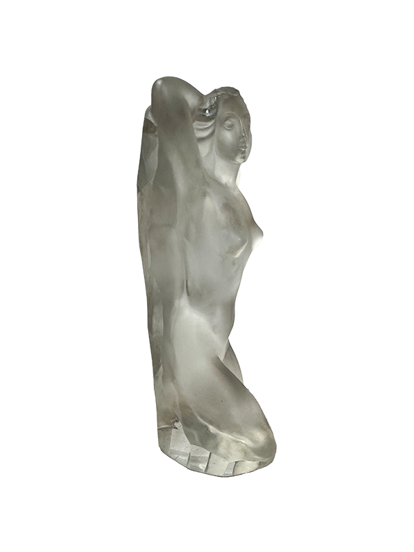 Frosted glass sculpture of a female figure on a white background