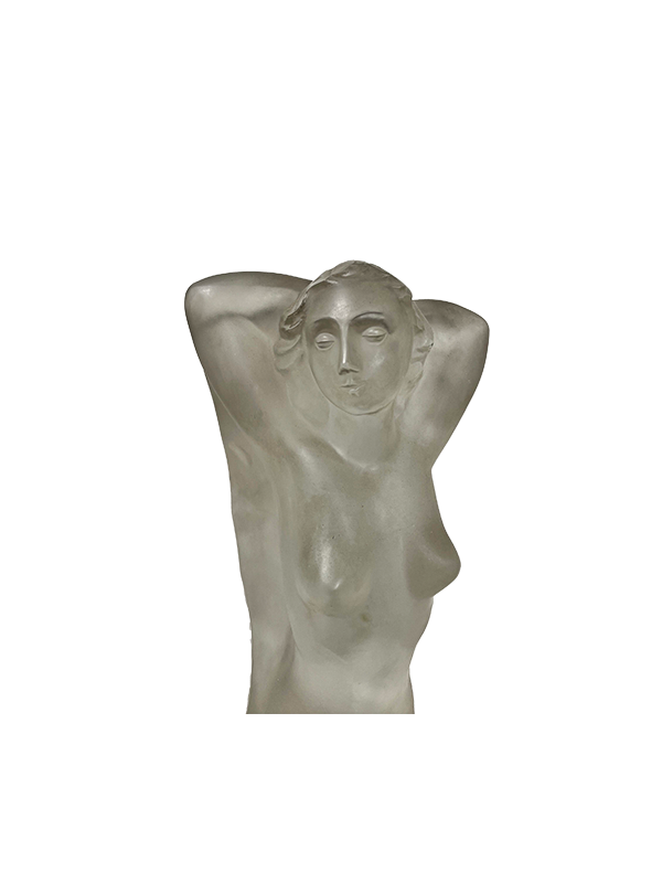 Close up of a frosted glass a female figure statue on a white background