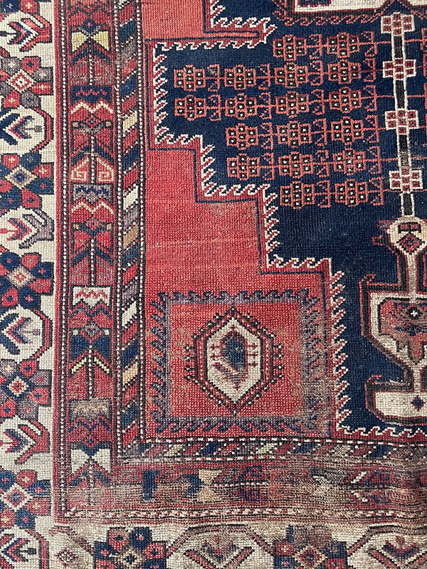 Close-up of an intricately designed rug with geometric patterns.