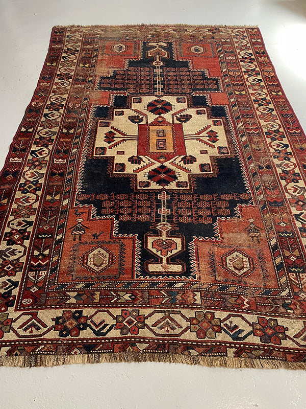 Traditional patterned rug on a plain background