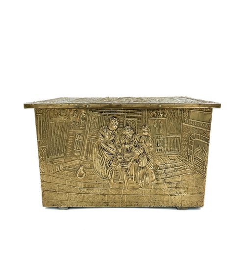 Decorative brass chest with intricate designs on a white background