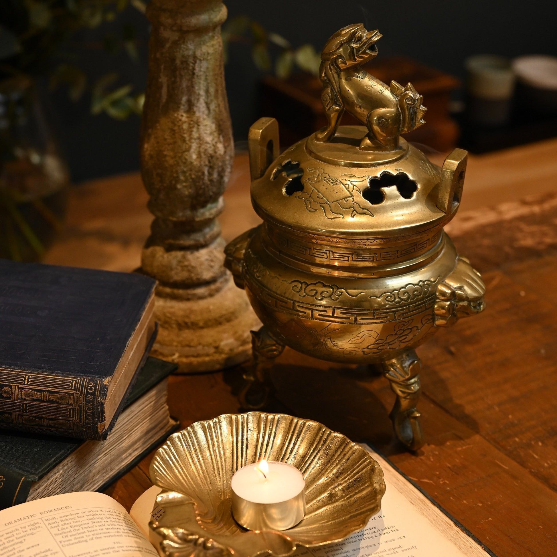 This solid brass Chinese incense burner, topped with a foo dog symbolizes protection and guardian spirit energy.  Cira 1950's.