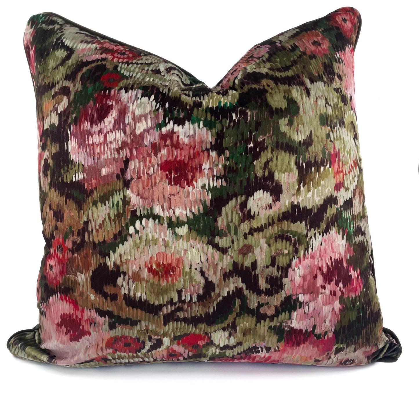Decorative pillow with floral and paisley pattern on a white background