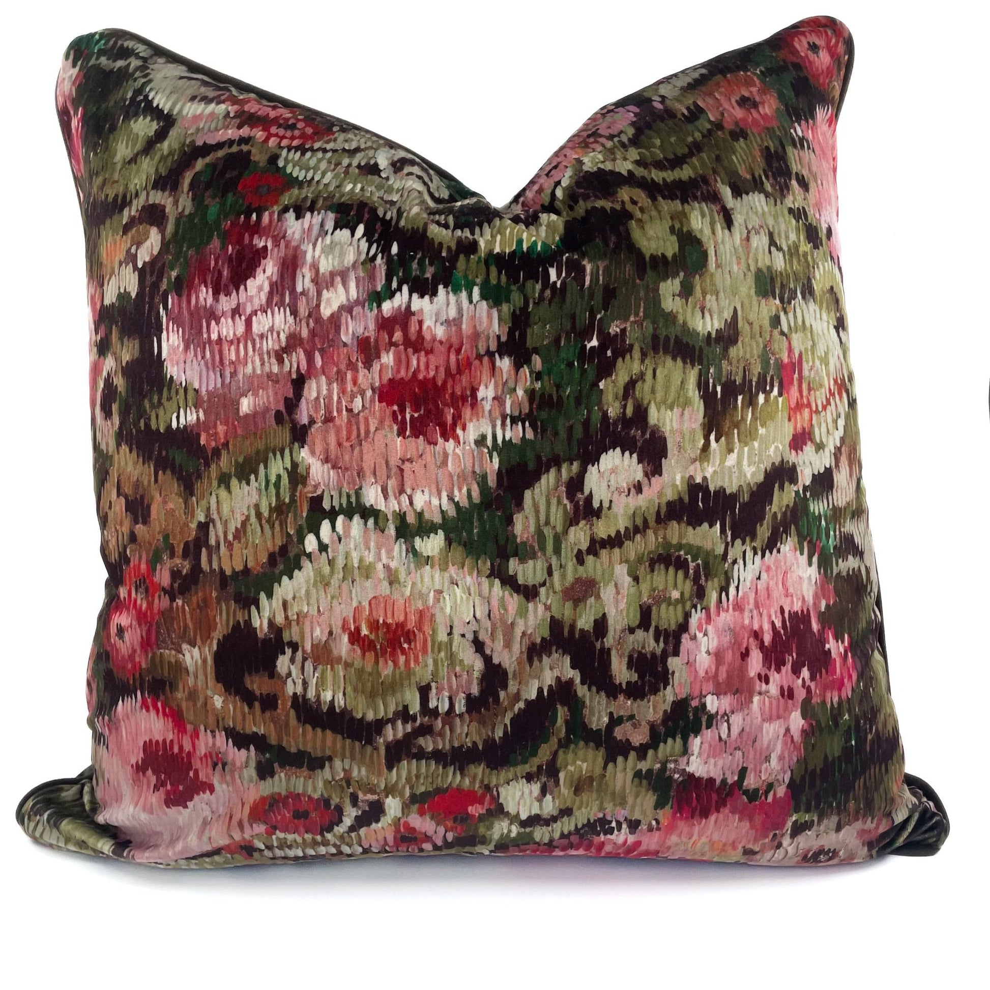 Decorative pillow with floral and paisley pattern on a white background