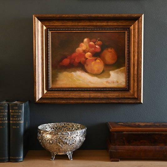 A classical still life in rich, warm tones, capturing the beauty of ripened fruit at rest against a deep backdrop, inviting a sense of abundance and nostalgia.