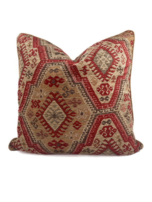 Decorative kelim style scatter cushion with red and beige geometric pattern on a white background