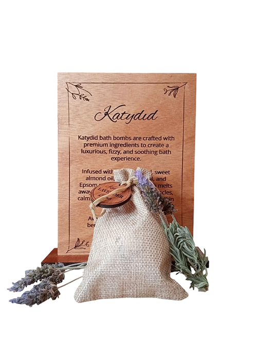Katydid bath bomb packaging with lavender and wooden label on a white background