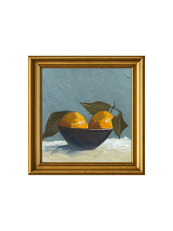 Framed painting of a still life with oranges and a bowl on a textured surface.