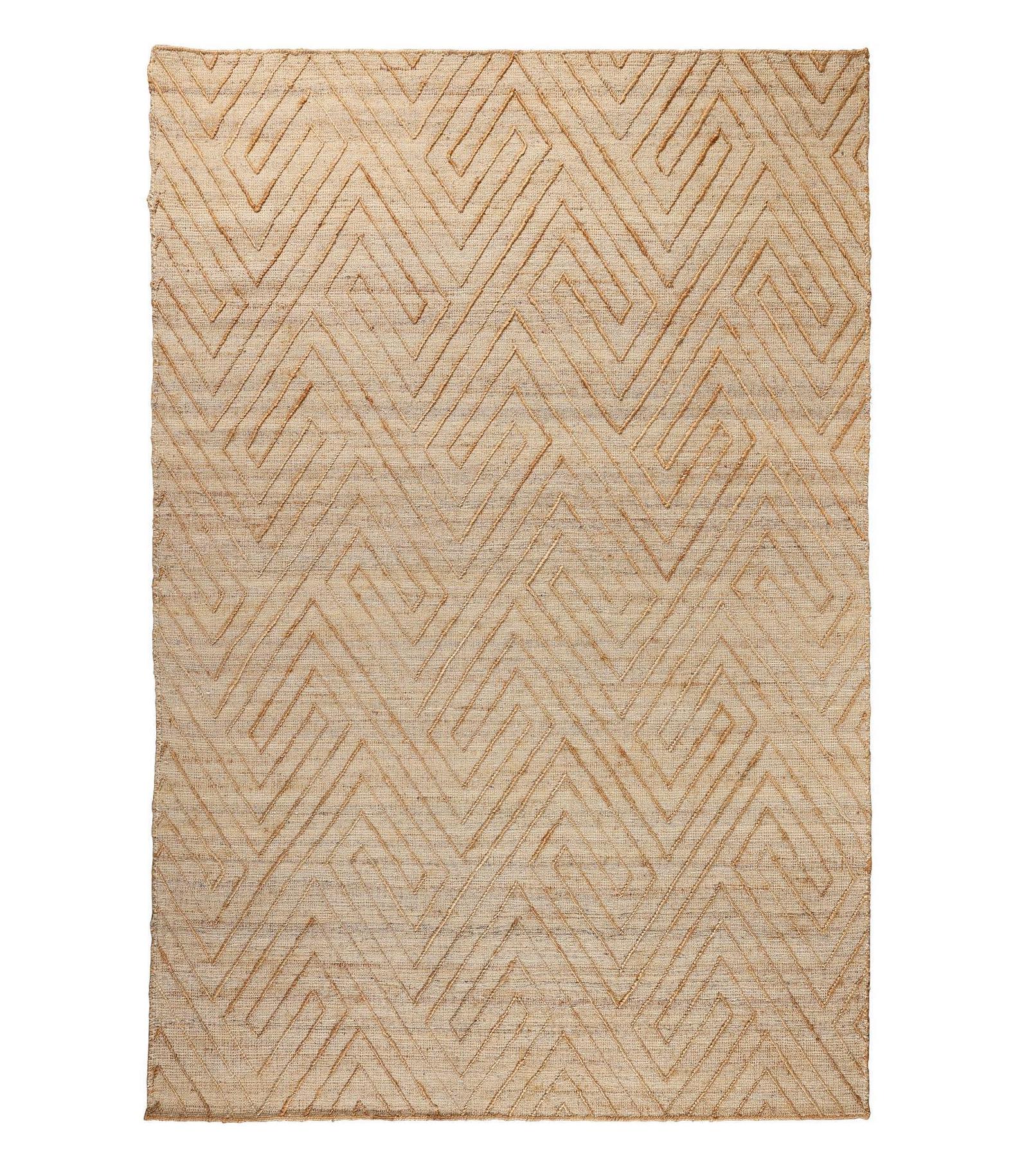 Beige woven rug with geometric pattern on a white background