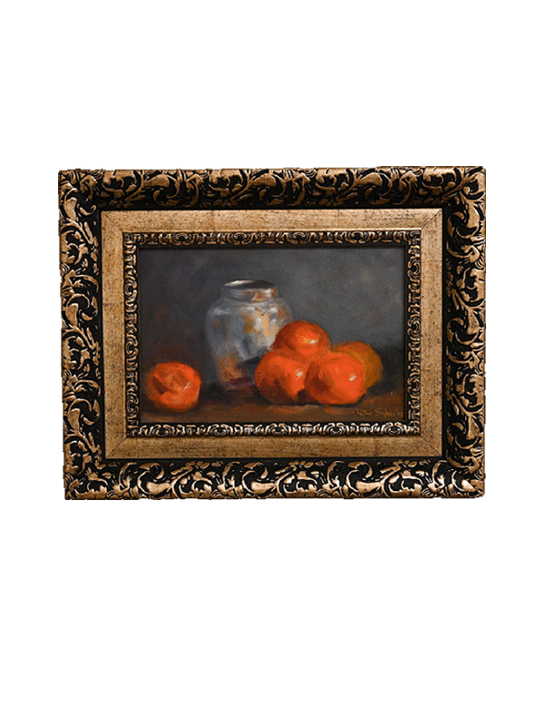 Framed still life painting of oranges ad a silver vase  on a white background