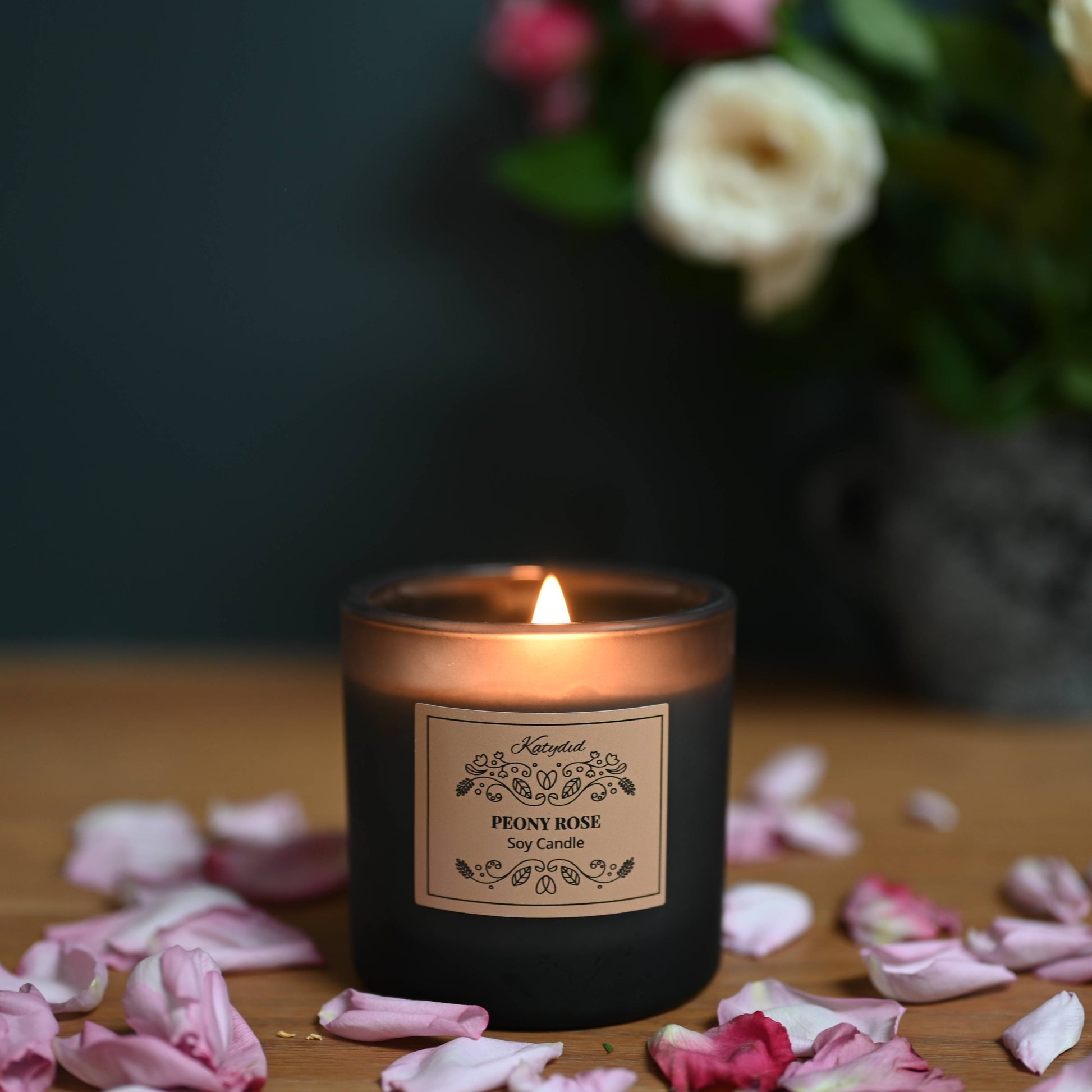 The Peony Rose Candle a romantic blend of soft peony petals and fresh, blooming roses, creating a floral bouquet.  Hand poured using natural soy wax