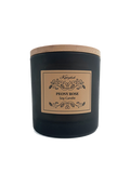 Black candle with a wooden lid and decorative label on a white background