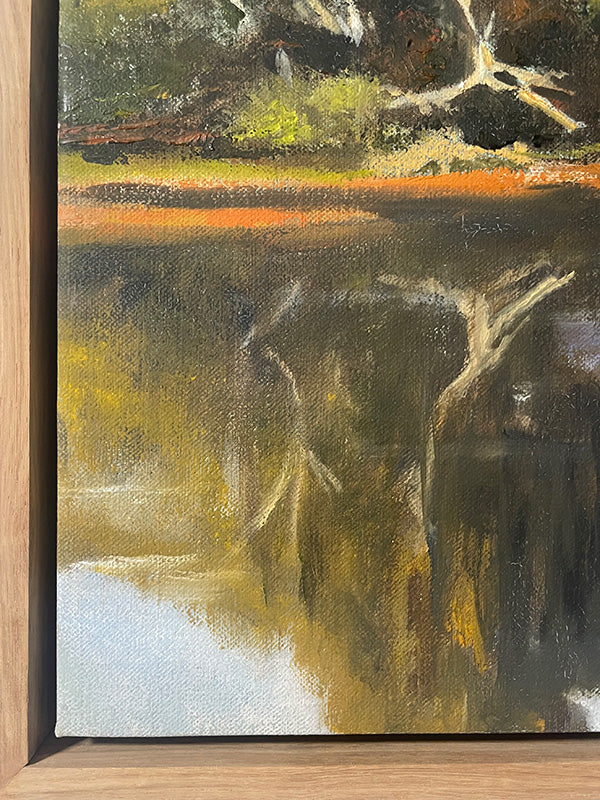 Original oil painting of a natural landscape with trees and water, framed in wood.