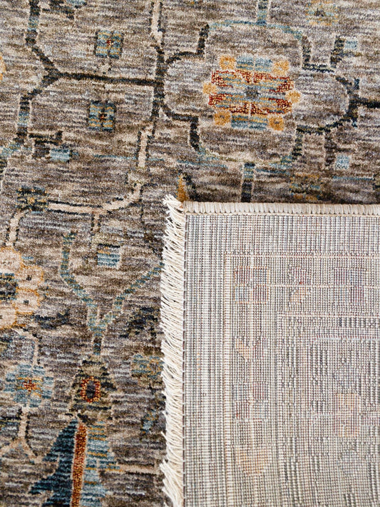 Close-up of two patterned rugs with a visible transition area.