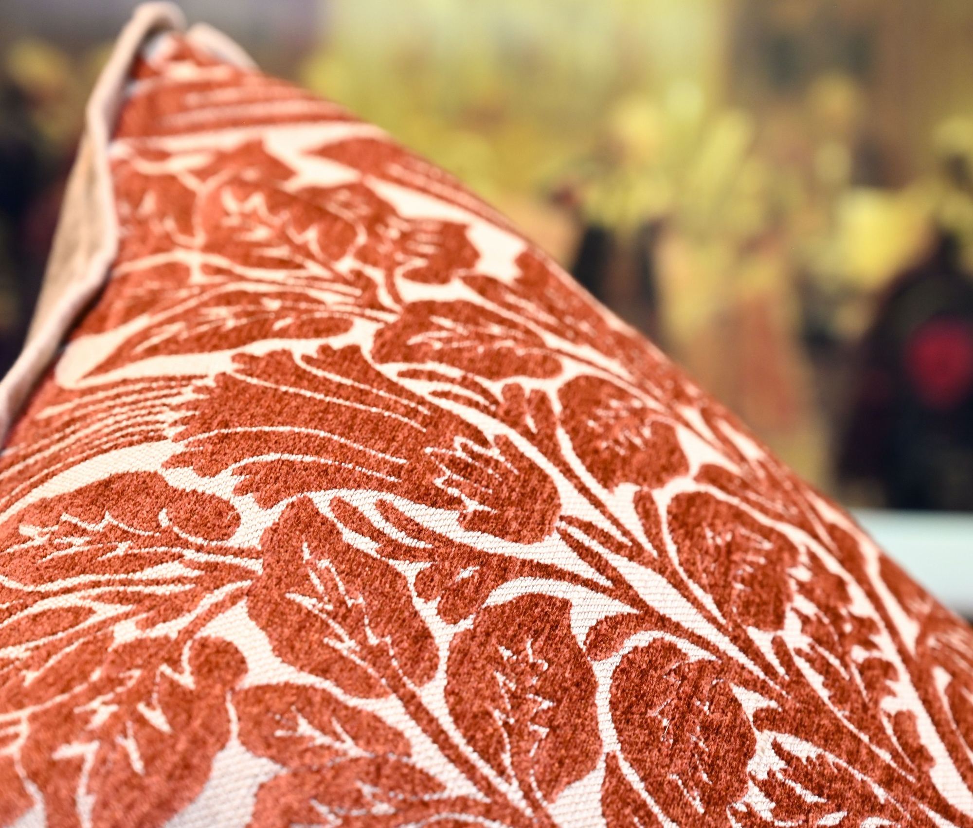 Close-up of a red and white floral patterned fabric with a blurred background