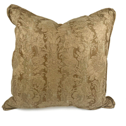 Decorative pillow with intricate gold pattern on a white background