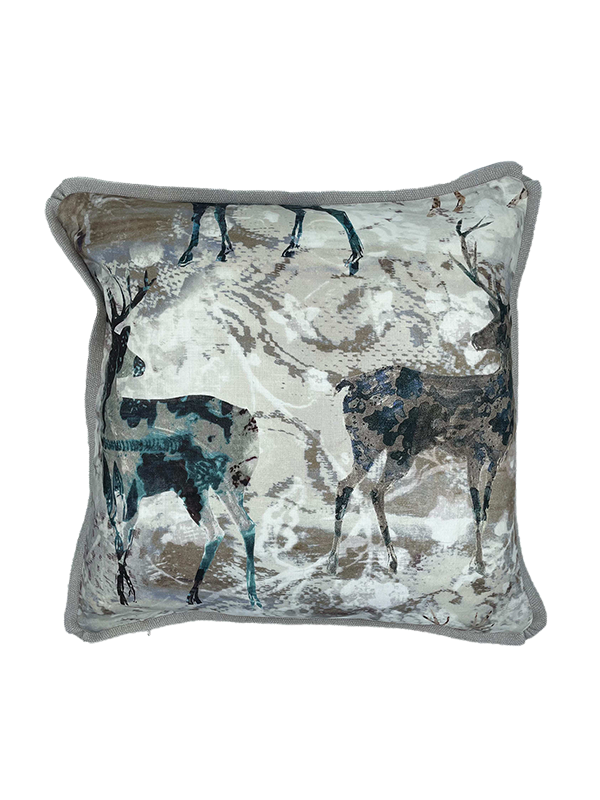 Decorative linen scatter cushion with stag design on a white background