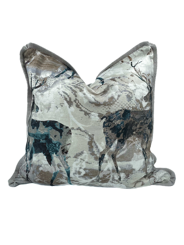 Decorative linen scatter cushion with deer pattern on a white background