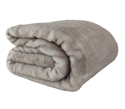 Folded gray blanket on a white background