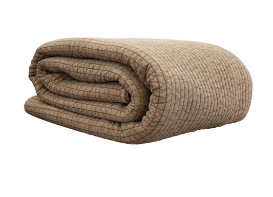 Crafted from premium 100% cotton and stonewashed for a softly weathered finish, this quilt exudes understated charm. 